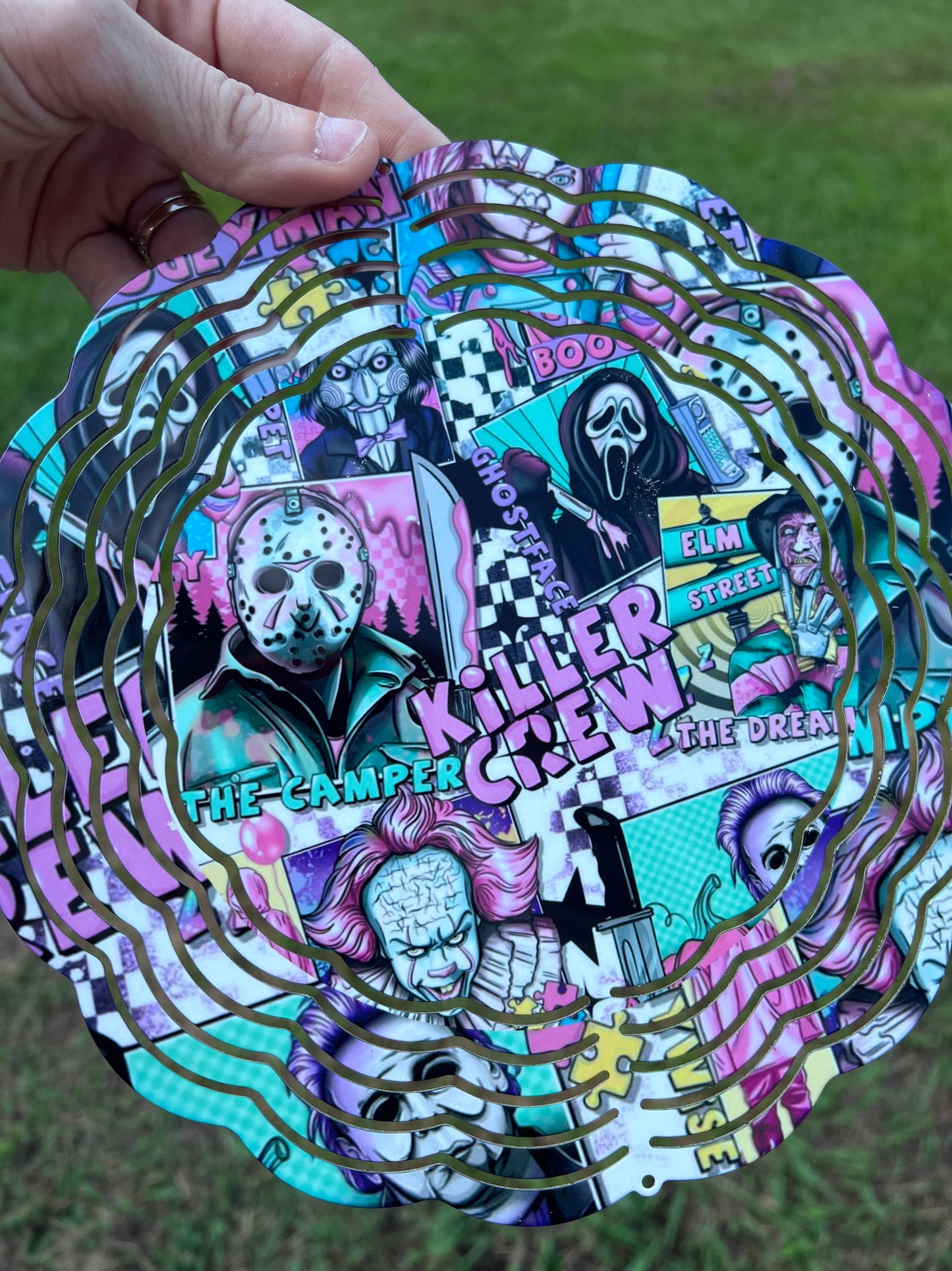 Horror movie villains wind spinner featuring colorful slasher inspired artwork