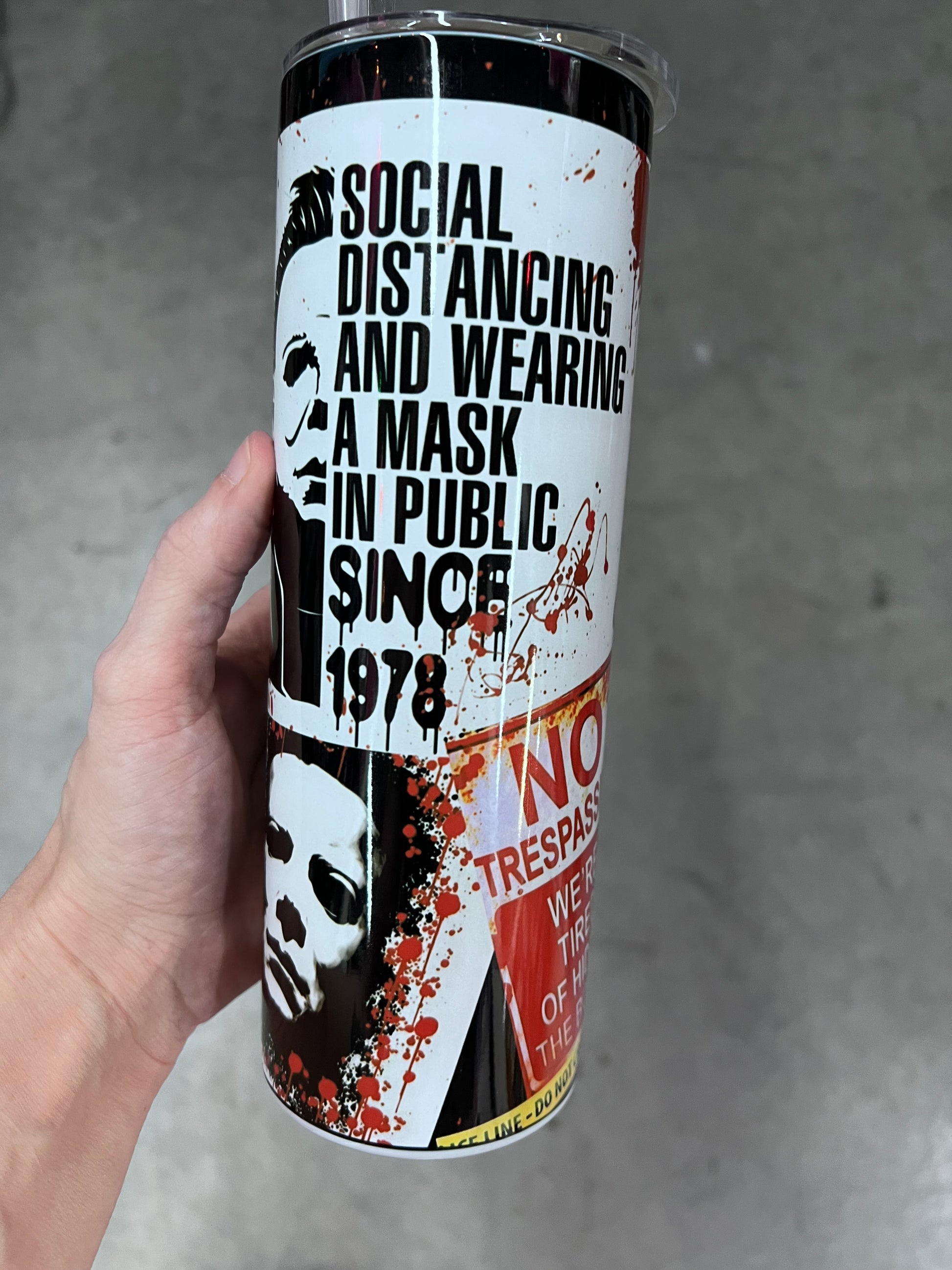 Michael Myers horror tumbler side view with 'No Trespassing We're Tired of Hiding the Bodies' warning sign graphic⁠