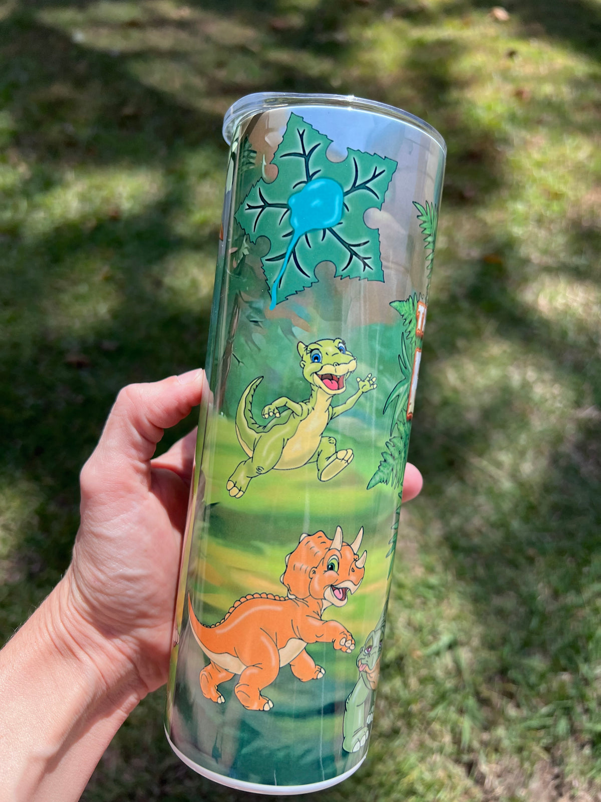 KimTheGrimm The Land Before Time Littlefoot and dinosaur gang 20oz stainless steel tumbler cup.⁠