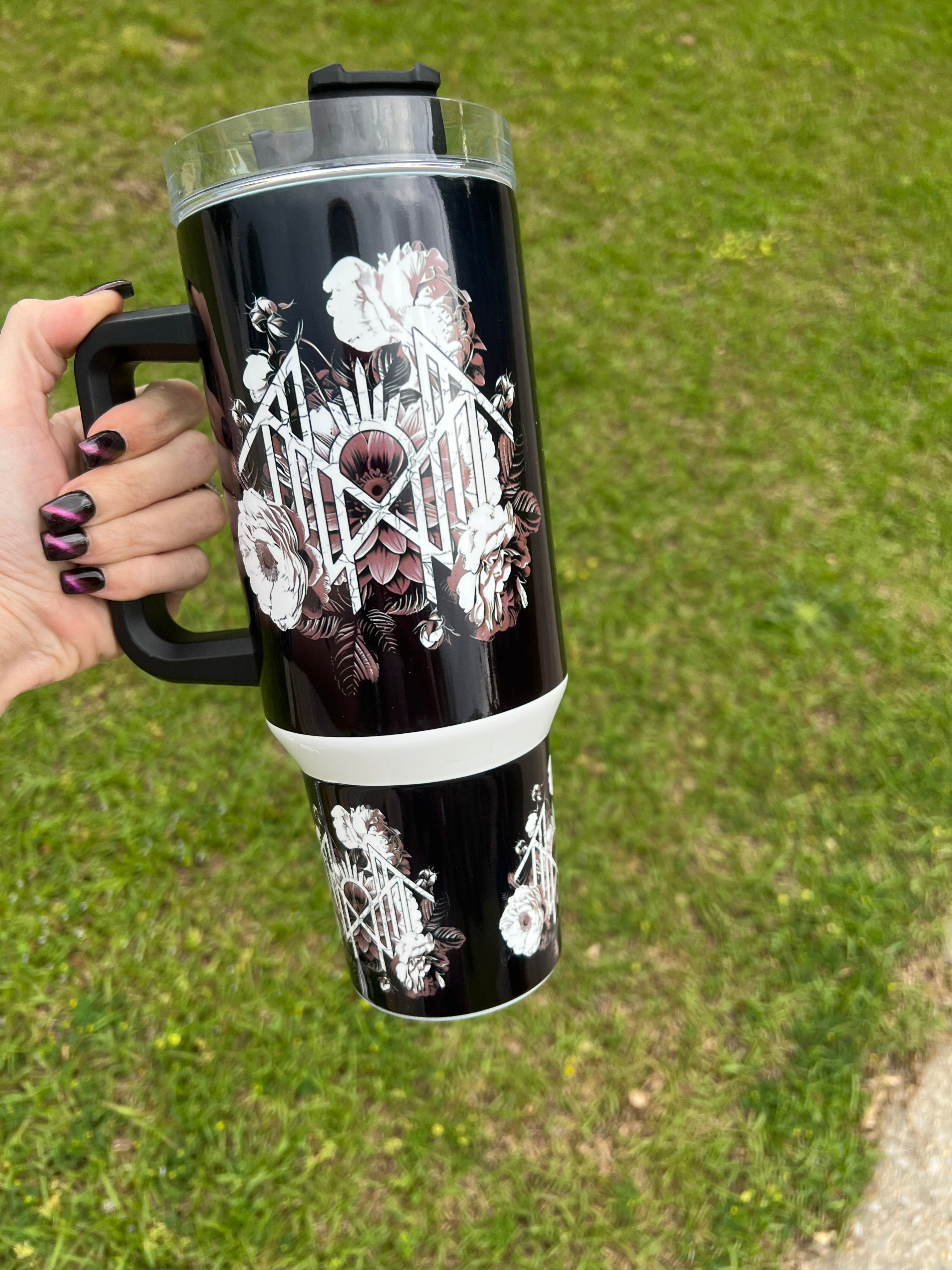 40oz white and black Sleep Token inspired tumbler with floral sigil design and handle.