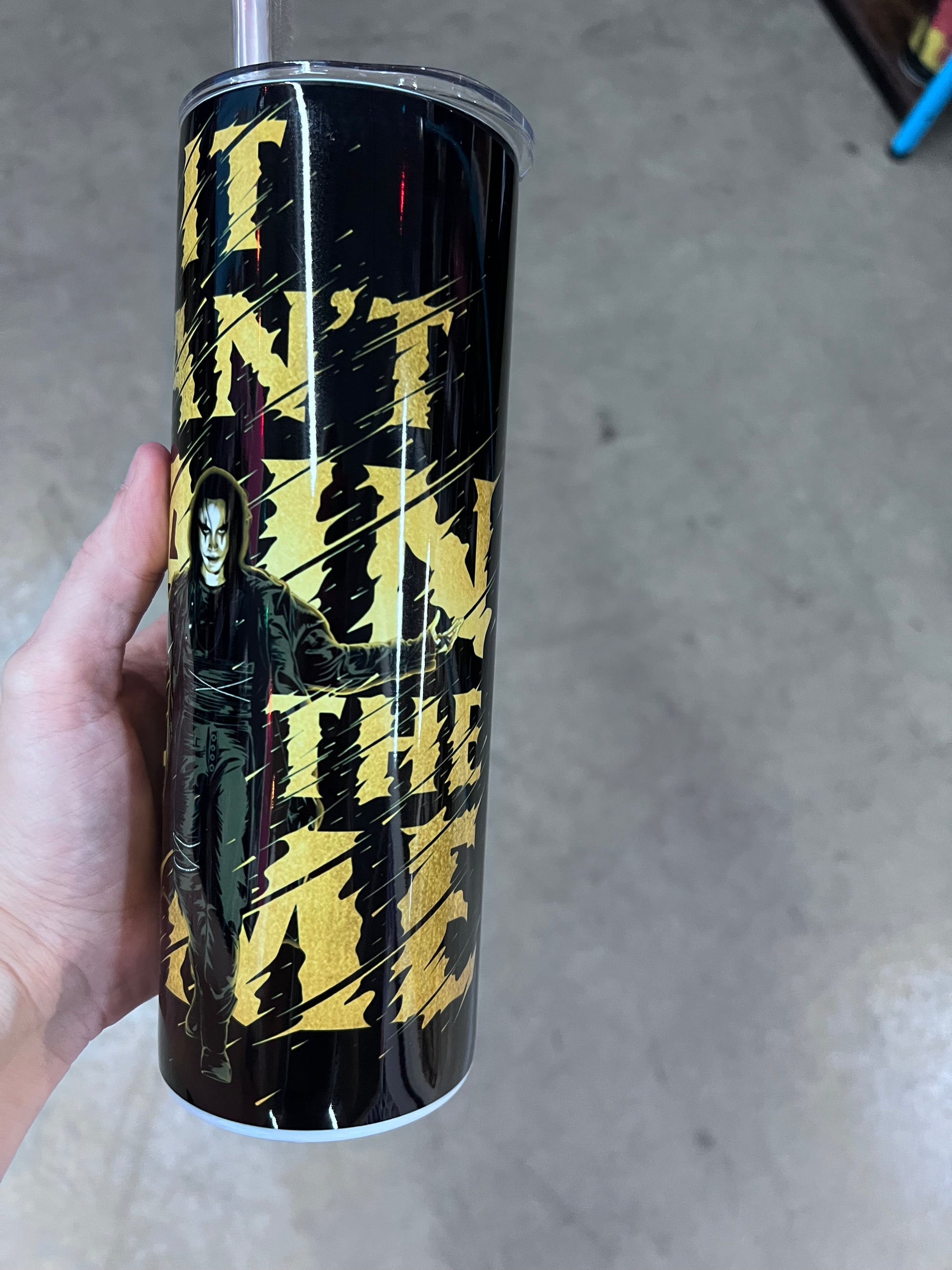 The Crow tumbler featuring Eric Draven in a black and gold gothic design