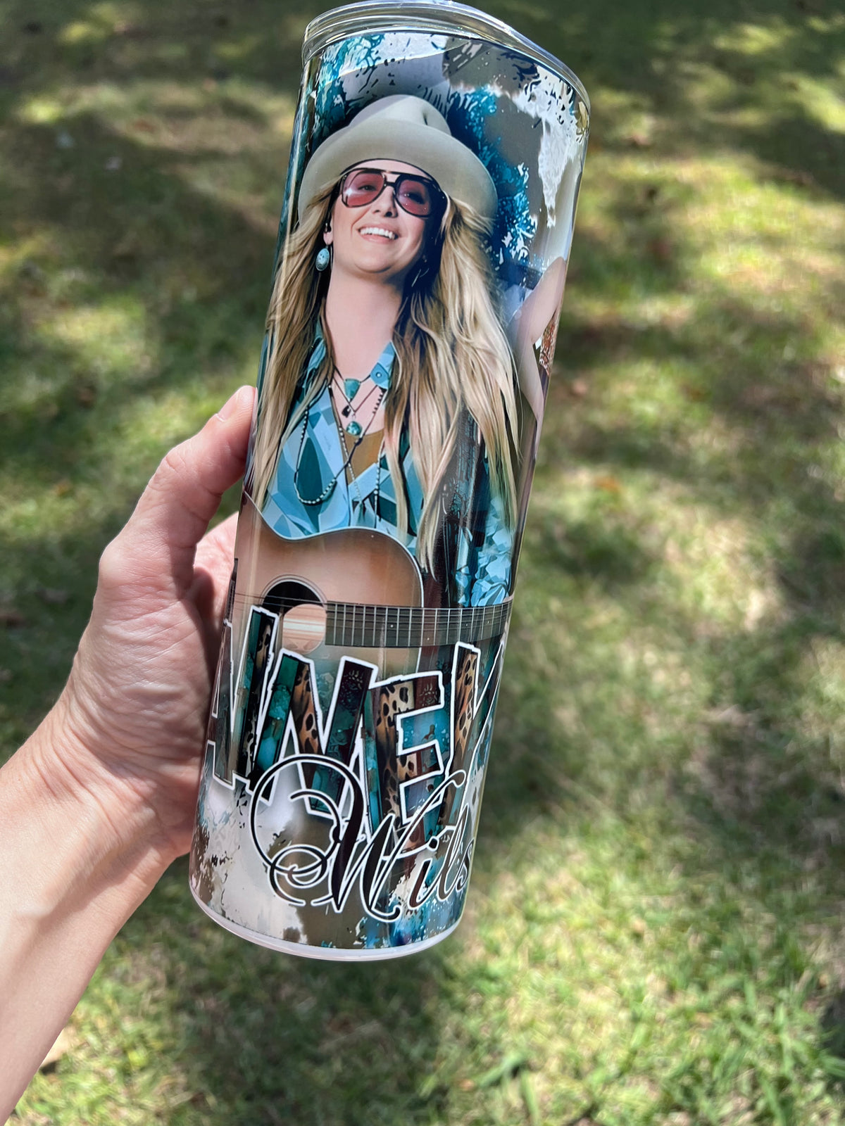 Lainey Wilson country music 20oz stainless steel tumbler cup with cowboy hat and acoustic guitar.