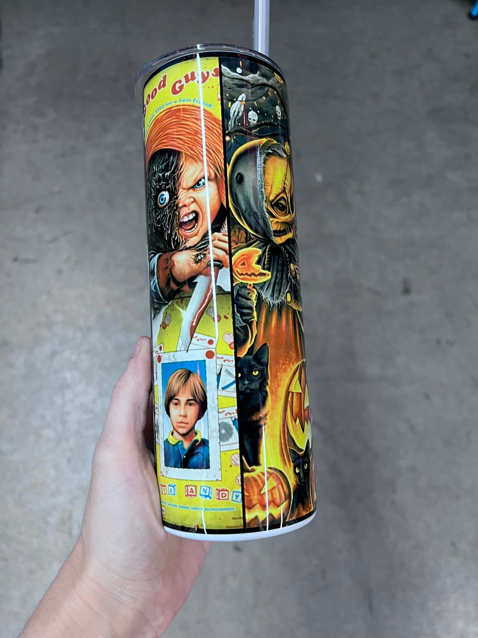 Horror movie character collage tumbler featuring Frankenstein, Jigsaw, Ghostface, Chucky, and other classic horror characters