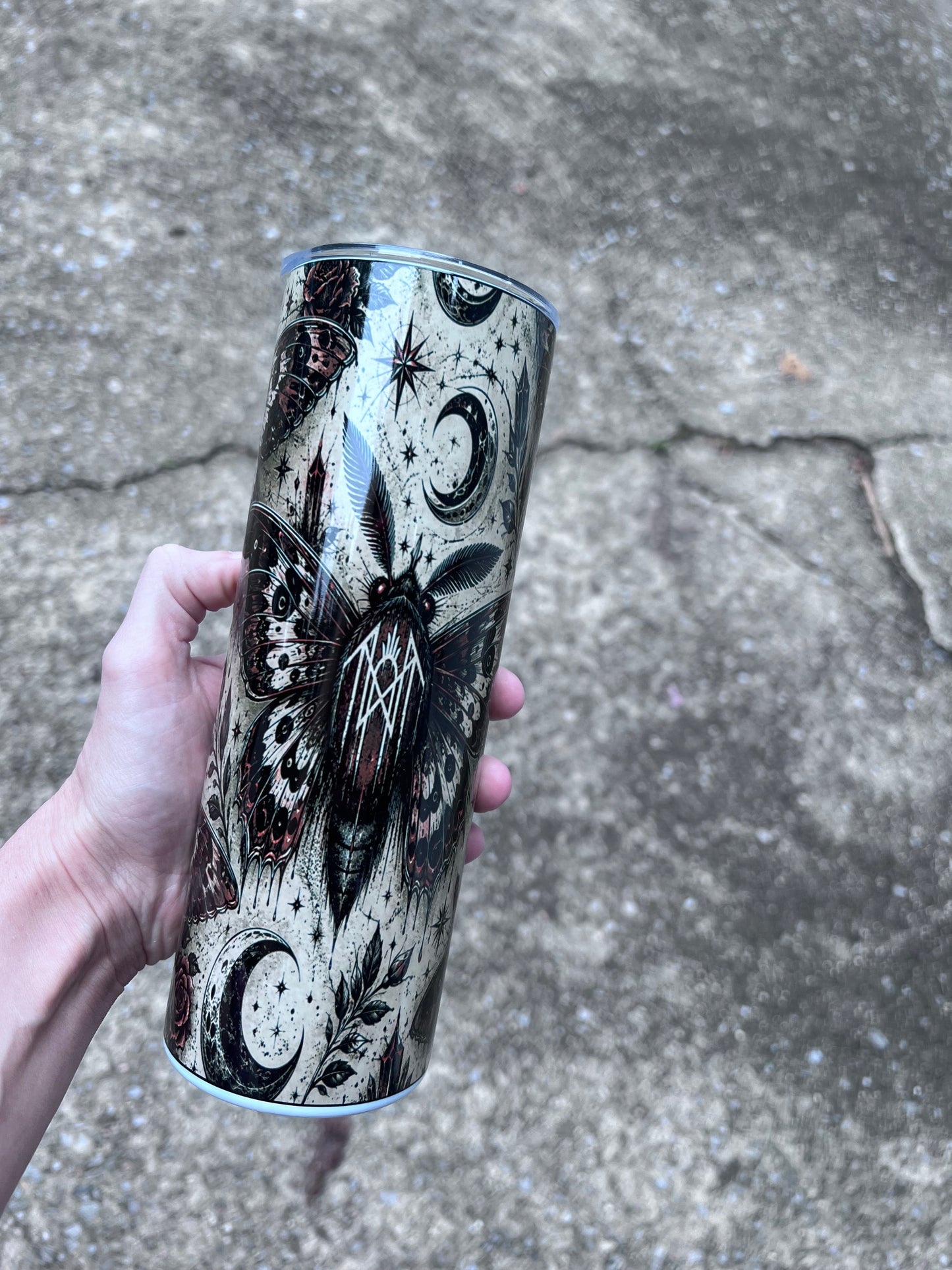 20oz stainless steel tumbler featuring gothic moth artwork, celestial moons, stars, crystals, and dark botanical elements inspired by Sleep Token aesthetics.