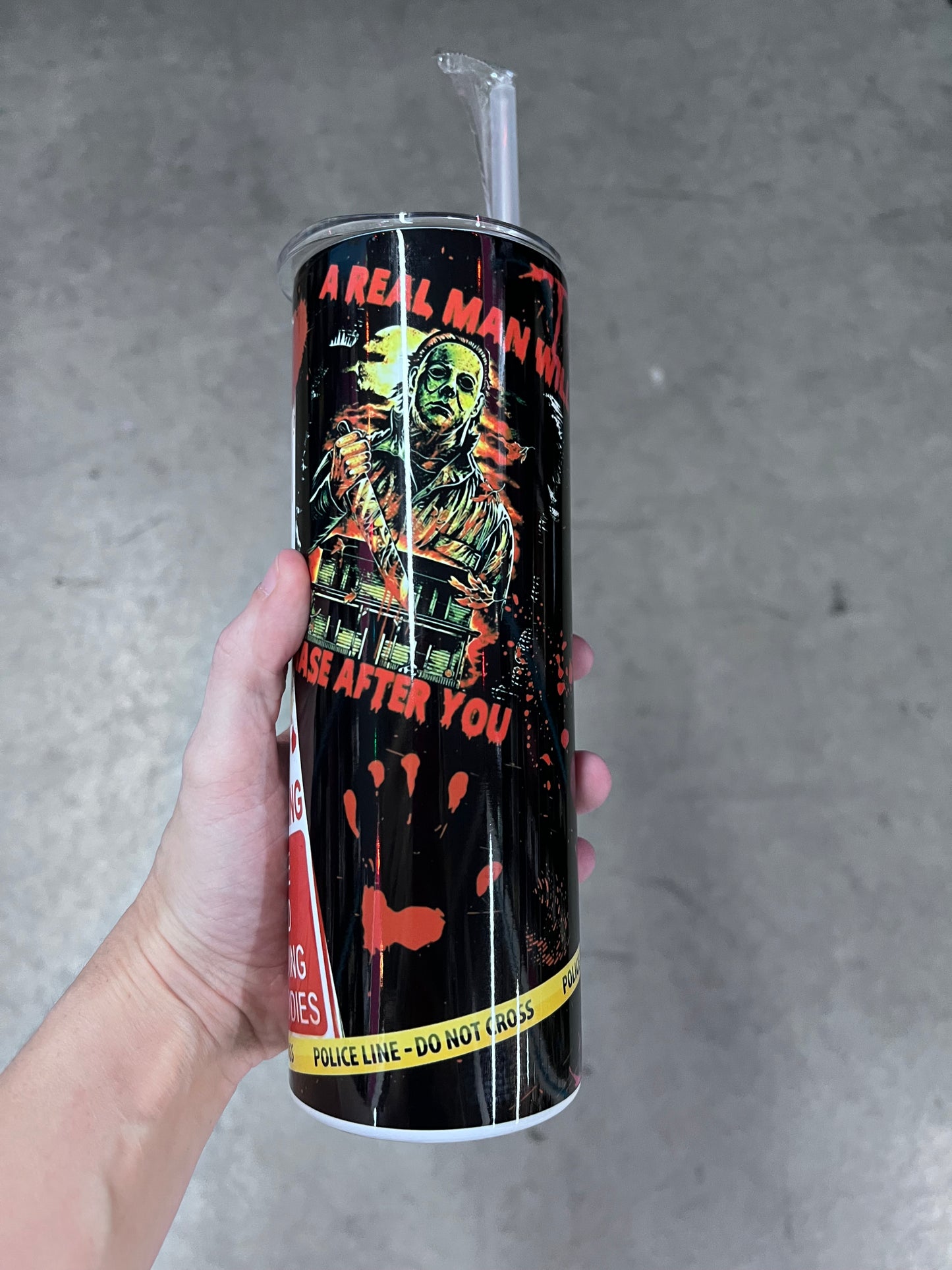 Black and white portrait graphic of Michael Myers on a horror movie custom tumbler with blood splatters⁠
