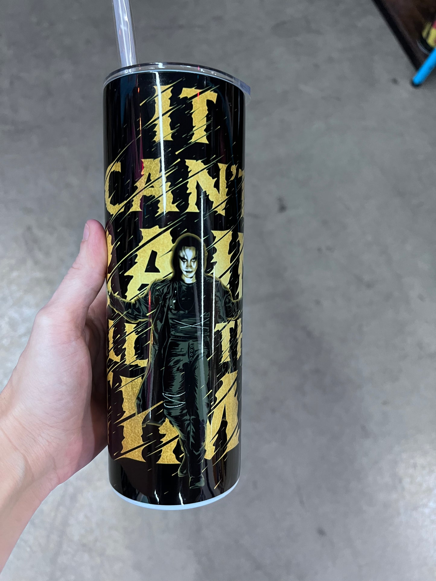 The Crow tumbler featuring Eric Draven in a black and gold gothic design