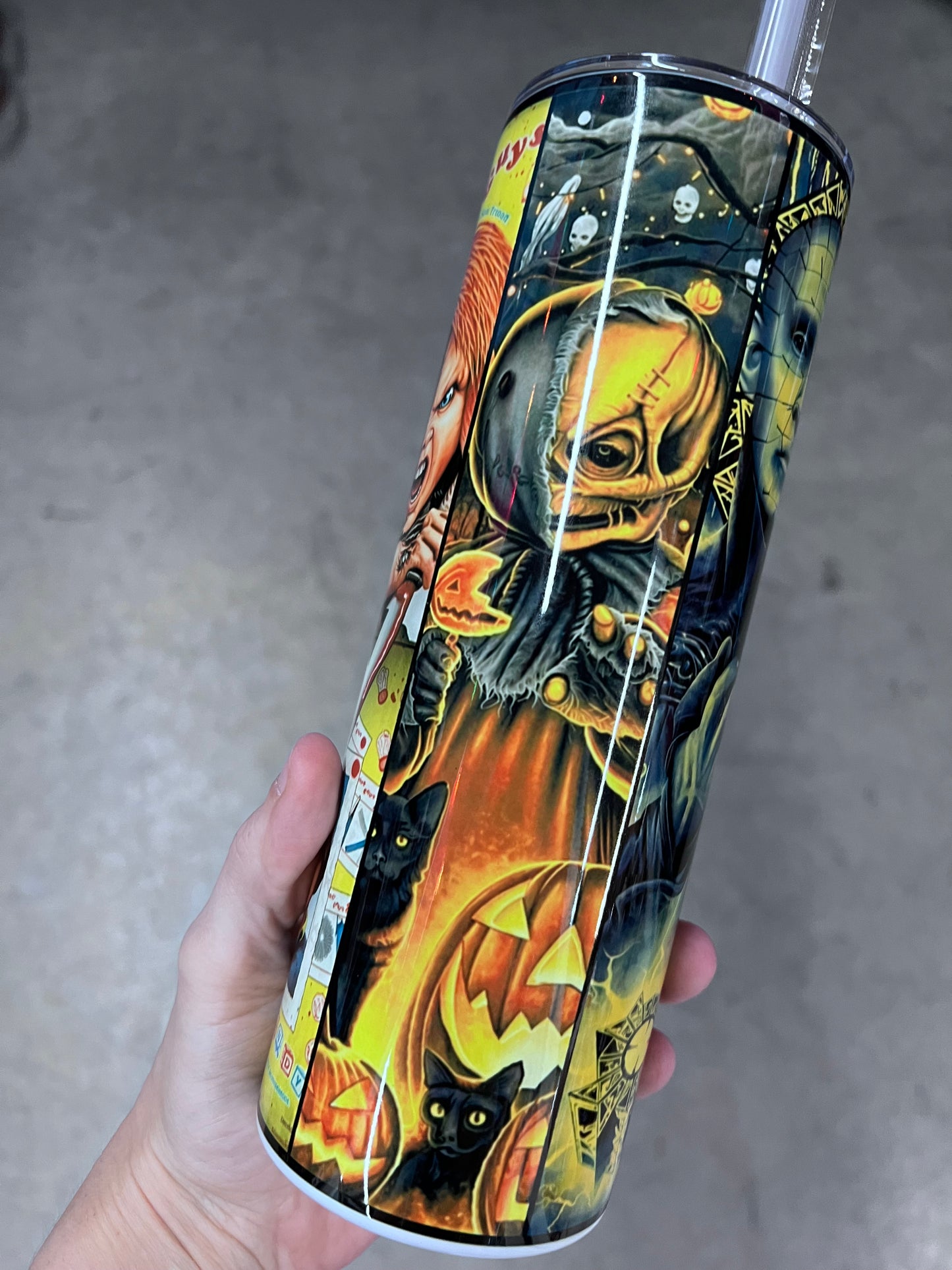 Horror movie character collage tumbler featuring Frankenstein, Jigsaw, Ghostface, Chucky, and other classic horror characters