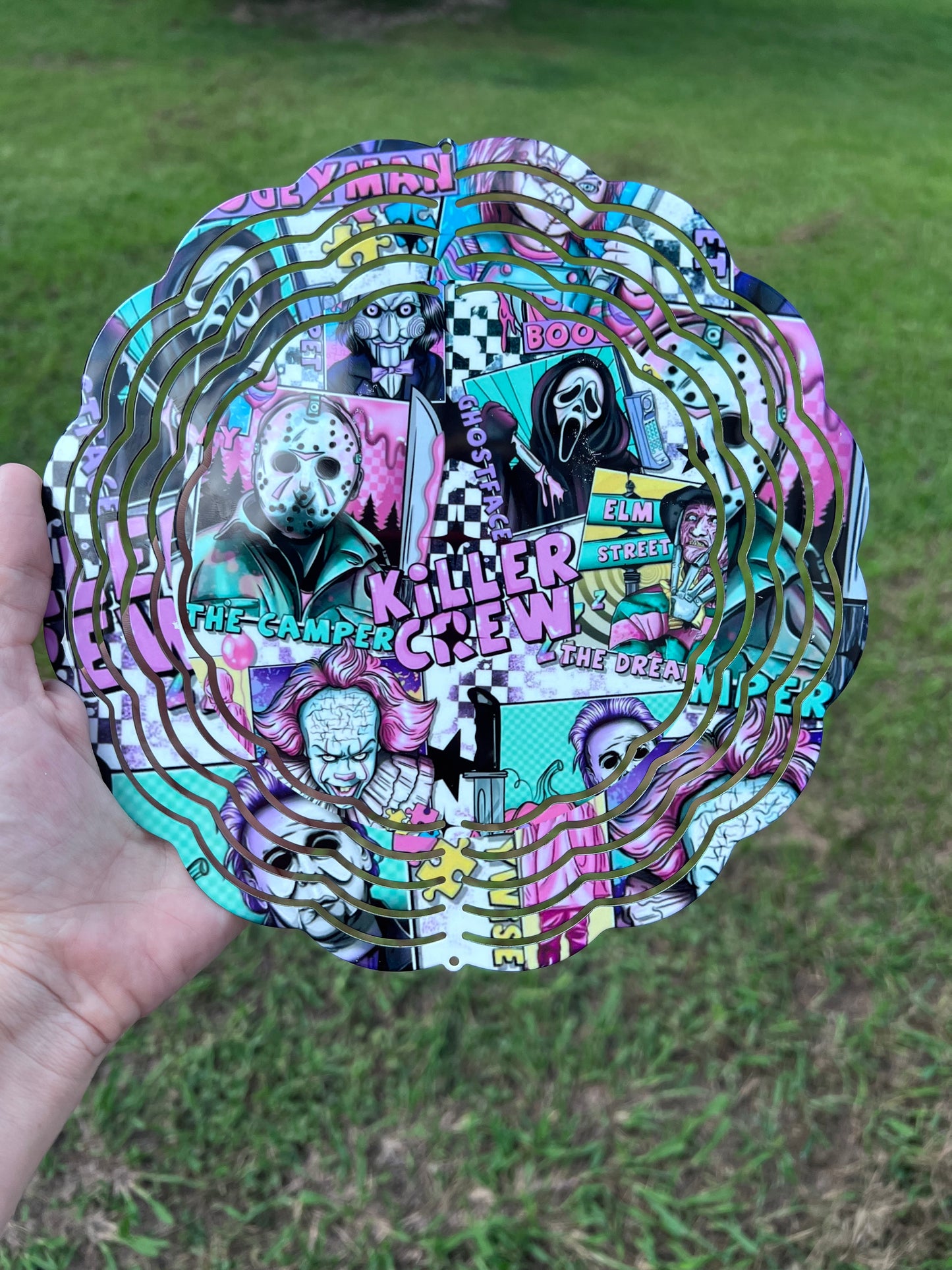 Horror movie villains wind spinner featuring colorful slasher inspired artwork