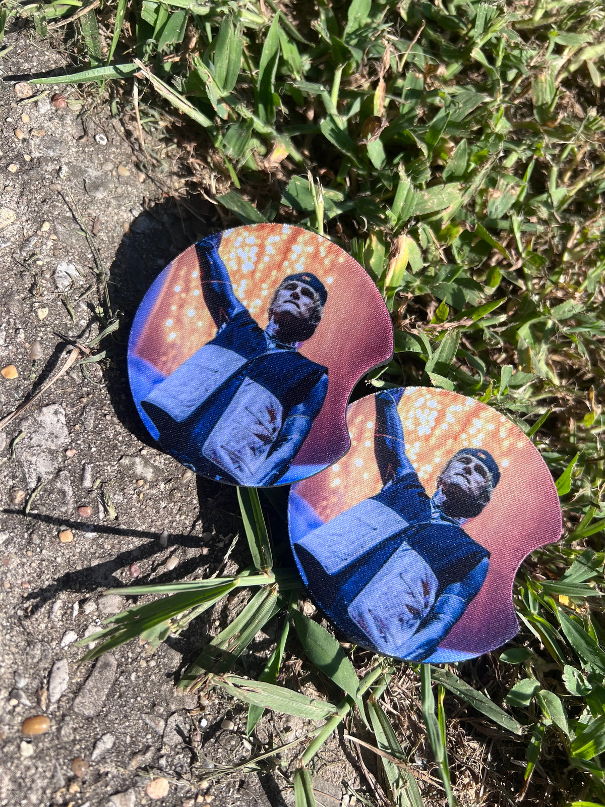 Machine Gun Kelly pop punk music coaster set inside car cup holder.⁠