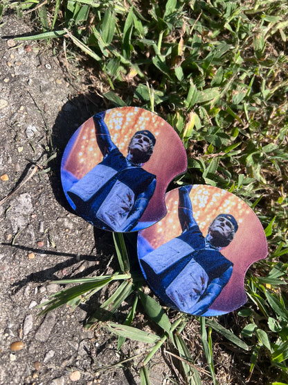Machine Gun Kelly pop punk music coaster set inside car cup holder.⁠