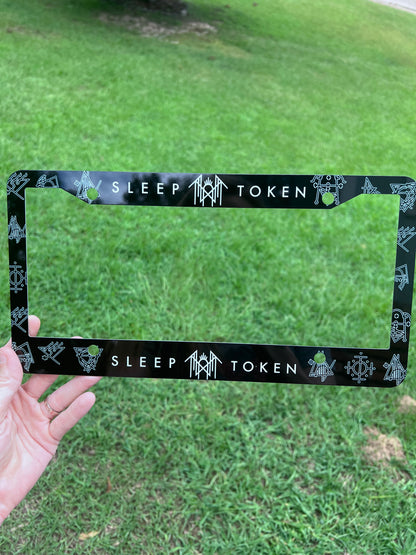 Close-up angle of the intricate runic symbols lining the Sleep Token alternative metal car frame