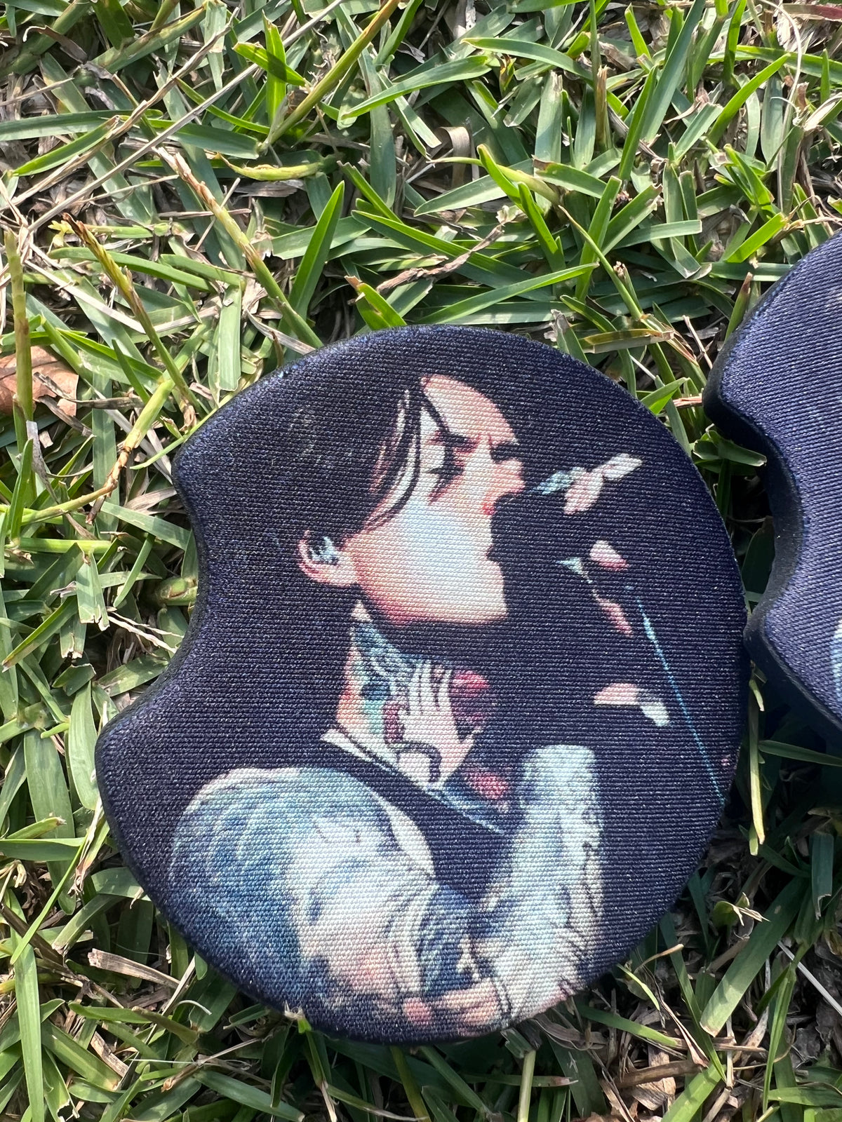 KimTheGrimm Noah Sebastian Bad Omens sublimated neoprene car coaster set of 2 in grass background.⁠