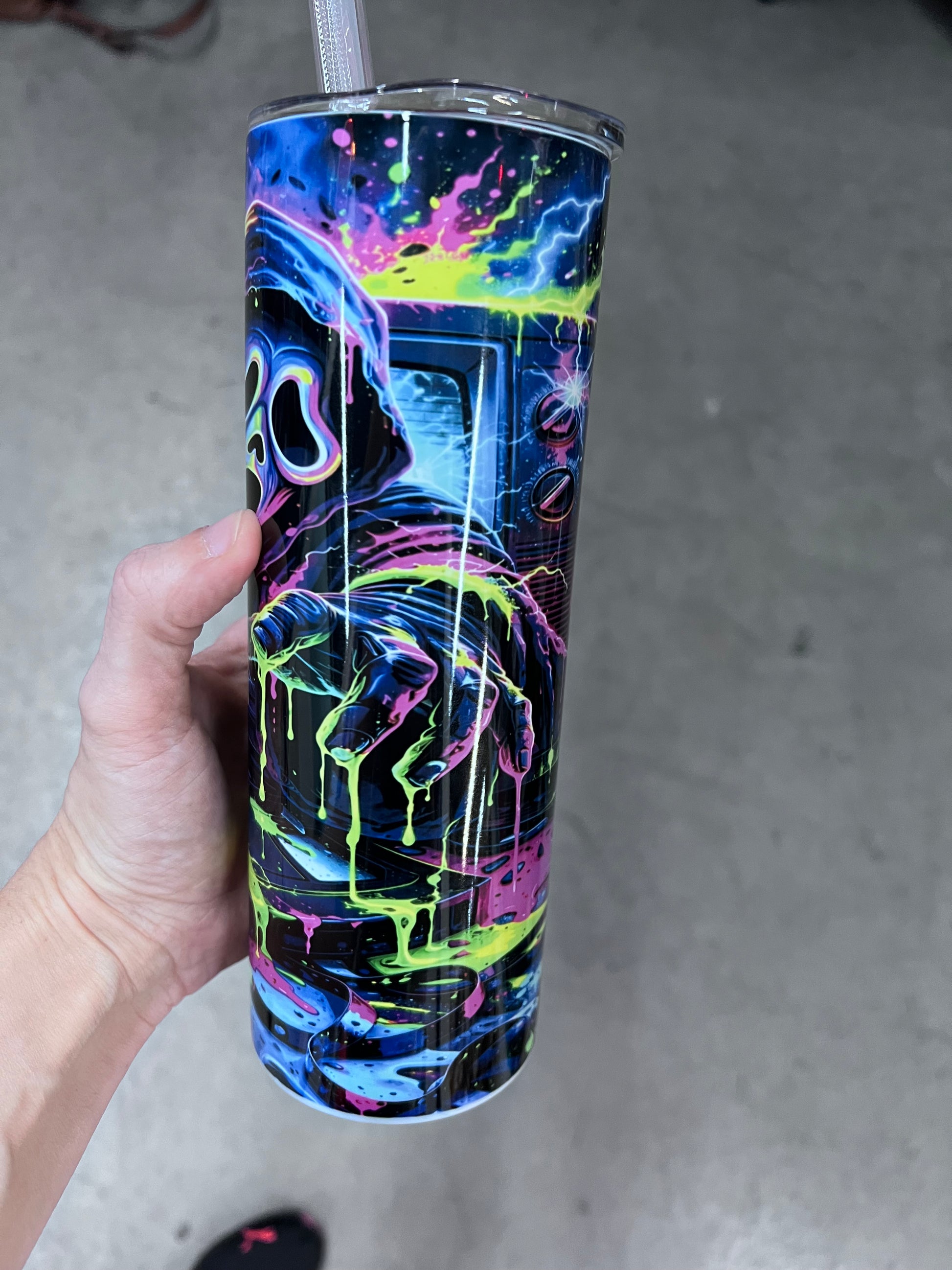 Neon horror Ghostface tumbler front view showcasing glowing mask and electric slime splatter⁠