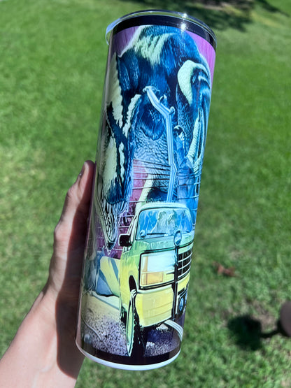 Retro 90s Jurassic Park 20oz skinny tumbler featuring a neon-purple sci-fi wrap with a T-Rex head and tour SUV.⁠