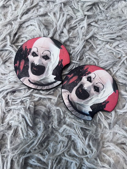 Art The Clown Horror Car Accessory Set | Terrifier Inspired Car Coasters & Vanity Plate | Spooky Horror Fan Car Decor featuring the design artwork