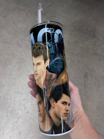 A hand holding a custom Twilight tumbler featuring a multi-image collage of Jacob Black set against a dark background with blue lightning strikes.
