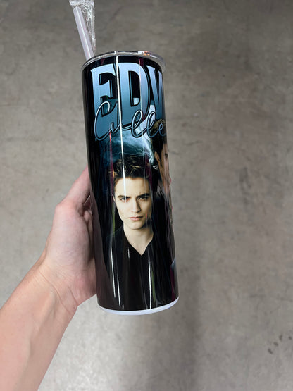 A hand holding a custom Twilight tumbler featuring the name "EDWARD" in bold blue text with "Cullen" in a cursive script, layered over an image of Edward Cullen in a black v-neck shirt.